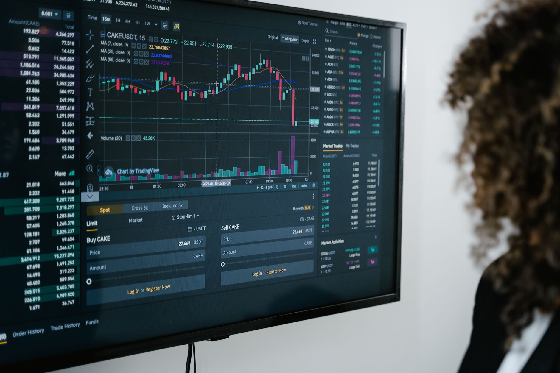 a person viewing a blockchain explorer with transaction hashes on a computer monitor