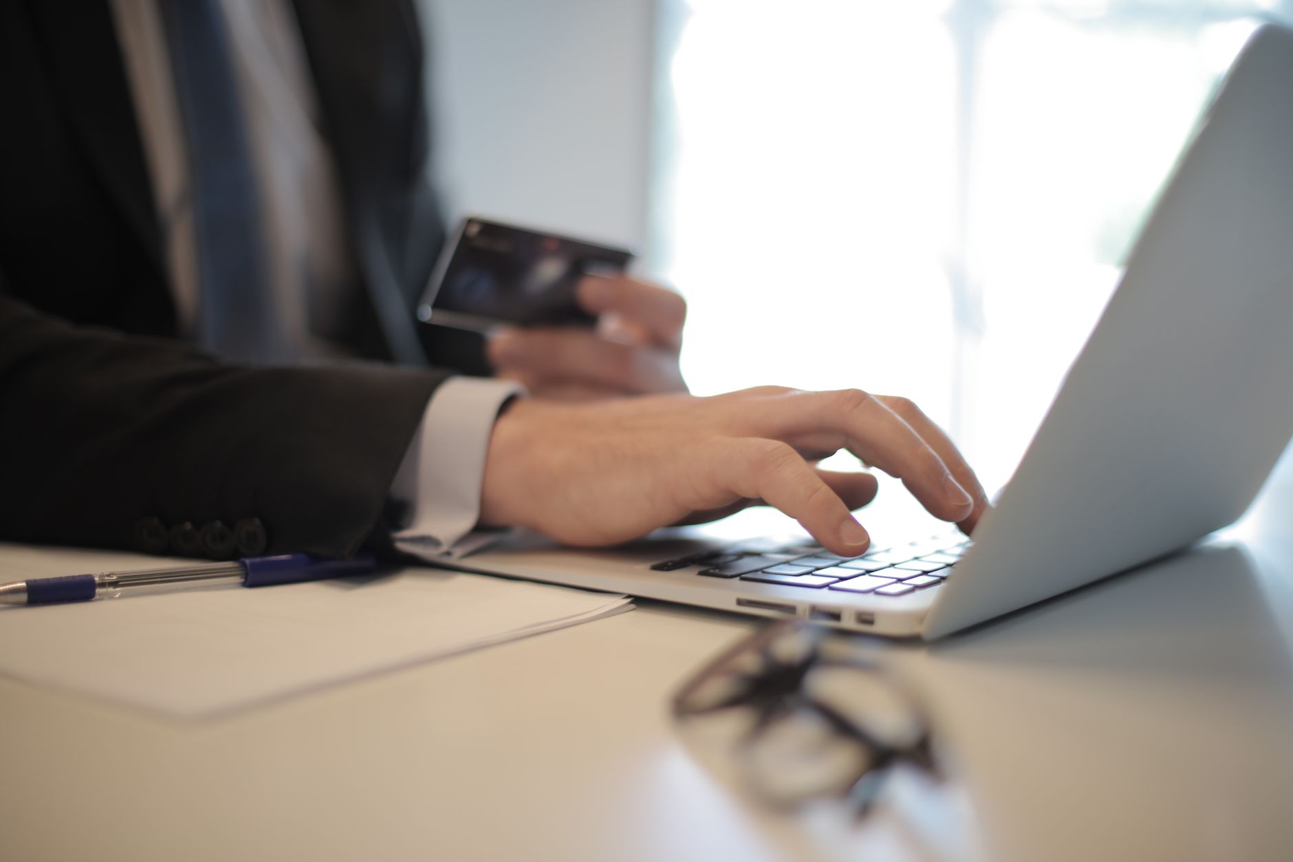 a person placing a credit freeze online on a laptop with the credit bureau website visible
